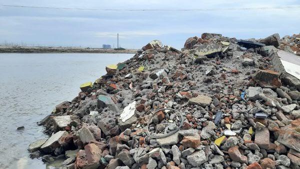 Image: Demolition debris dumped into the river