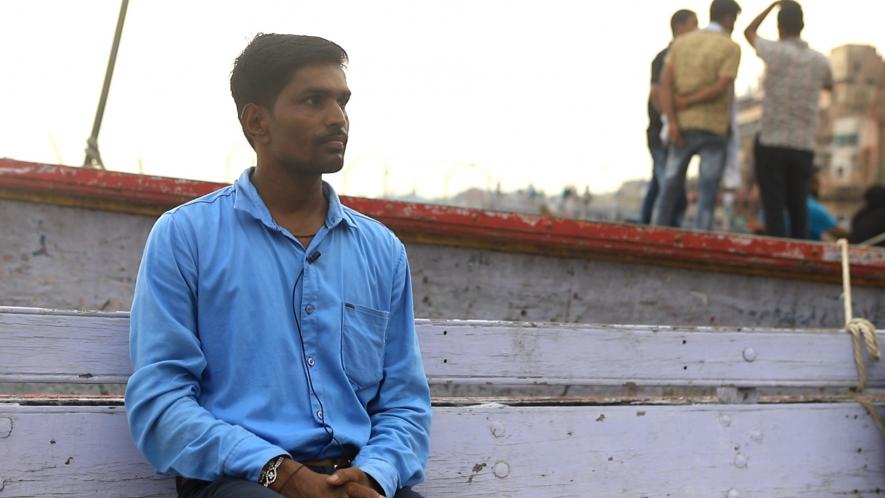 Rakesh Sahani/ Chulshu(his Korean name) from Varanasi sitting at the Dashashwamedh Ghat, Varanasi