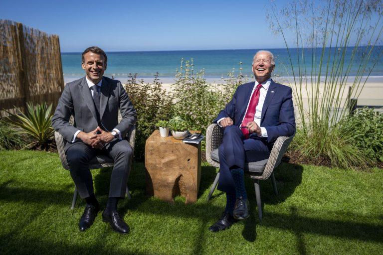 French President Emmanuel Macron (L) and US President Joe Biden enjoy a light moment at the G7, Cornwall, UK, June 12, 2021