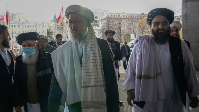 Taliban government’s deputy prime minister Abdul Salam Hanafi (C) and Acting Foreign Minister Amir Khan Muttaqi (R) arrive in Moscow to attend international talks on Afghanistan, Oct. 20, 2021