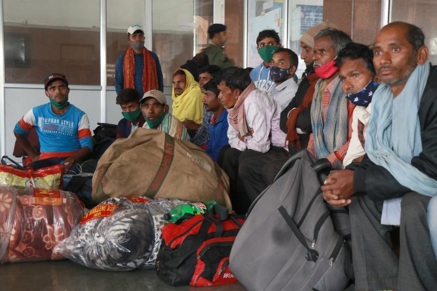Non local laborers waiting for train inside railwaysation Nowgam . Photo by Kamran Yousuf