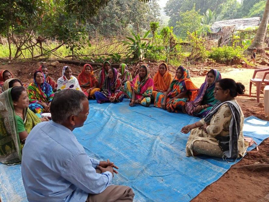 Bhagyalaxmi Biswal, Project Coordinator of Vasundhara discussing with villagers and CFR and how they can claim their rights over forest resources (Photo courtesy- Vasundhara)