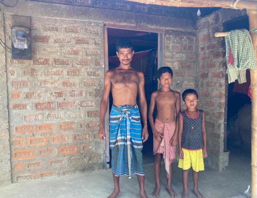 Kamrul with two of his sons