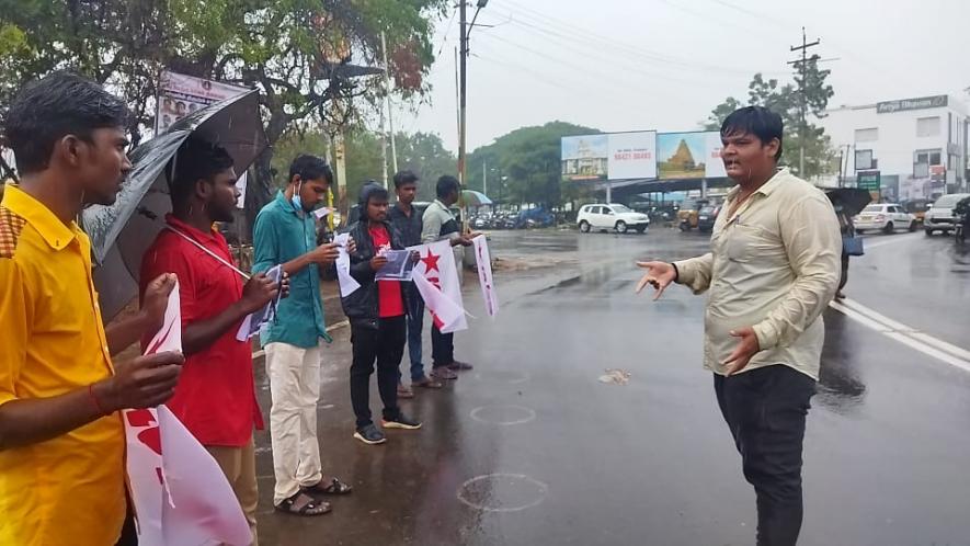 SFI activists holding solidarity protests despite severe rain in Thanjavur.