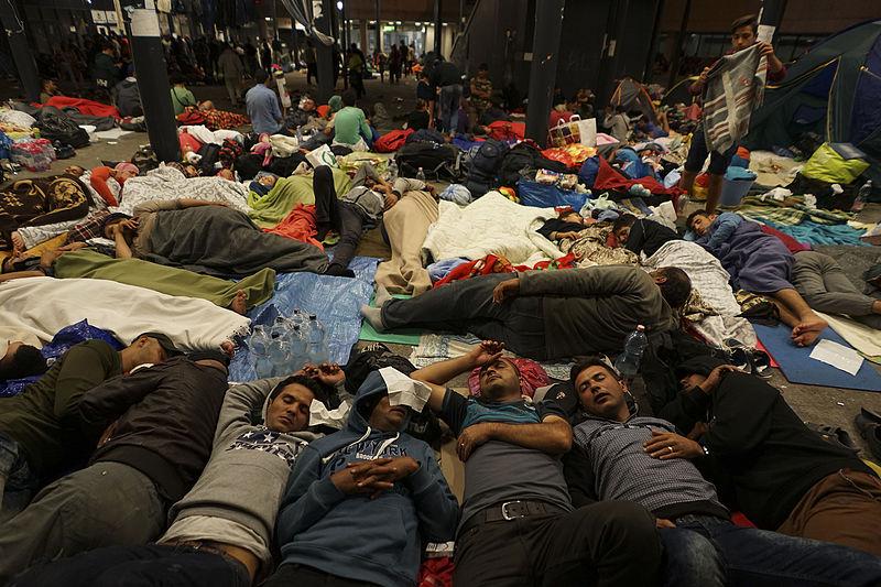 Syrian refugees having rest at the floor of Keleti railway station. Refugee crisis. Budapest, Hungary, Central Europe, 5 September 2015..jpg