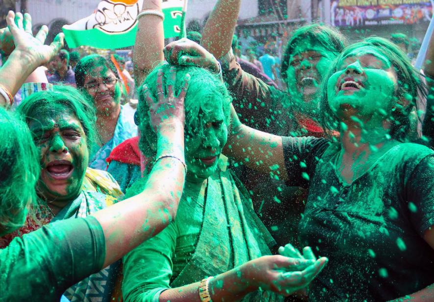 Trinamool Congress (TMC) supporters celebrate the party secures a victory in the West Bengal Municipal elections