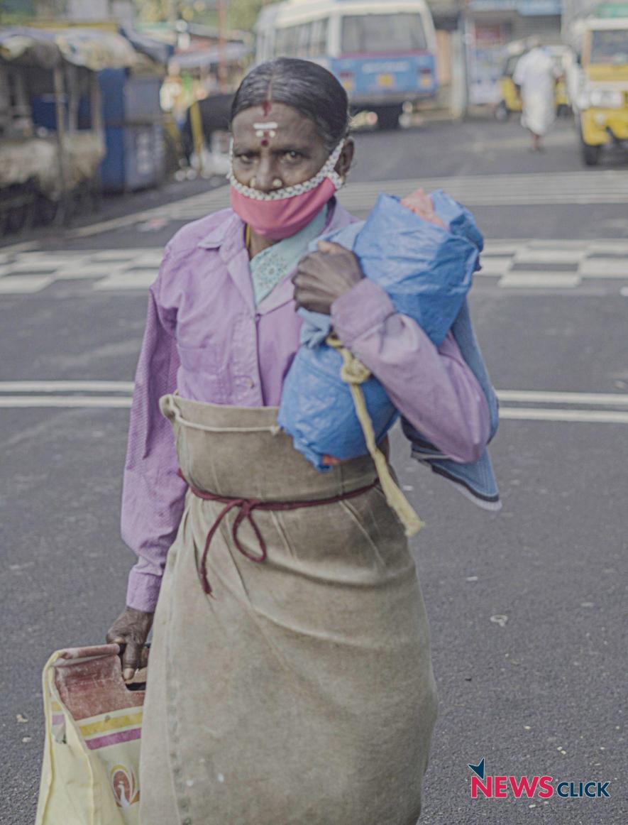 A tea plantation worker heads to work early in the morning.