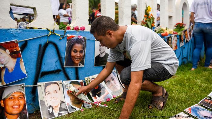 In January 2020, a year after the disaster, a man pays tribute to the victims of the Brumadinho dam accident