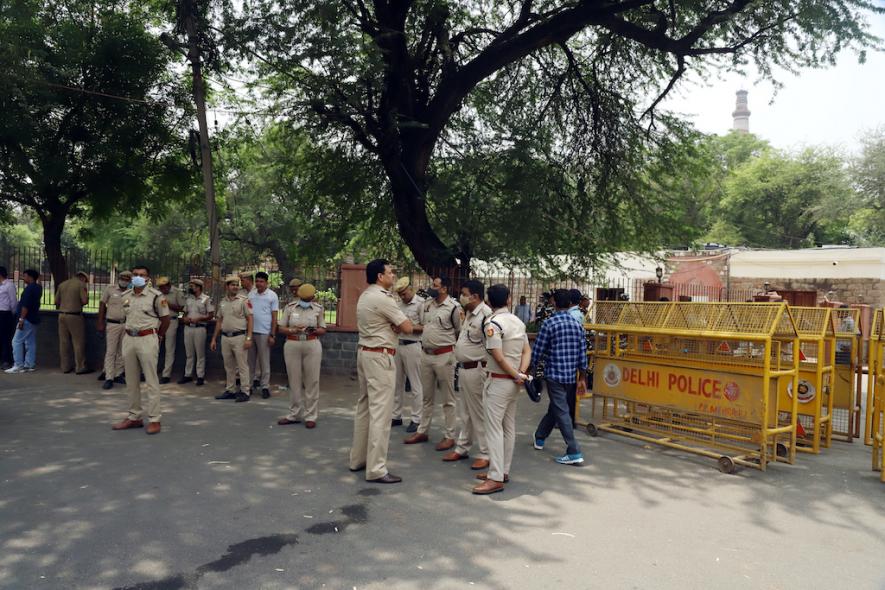 New Delhi, May 10 (ANI): Police stand outside Qutub Minar during a protest by members of right-wing organizations demanding to rename the monument to 'Vishnu Stambh', in New Delhi