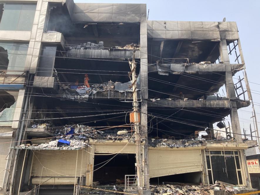 A three storey building was engulfed in fire on Friday evening. Image clicked by Ronak Chhabra