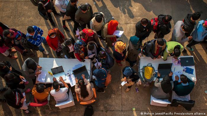 People line up at a job fair in New Delhi