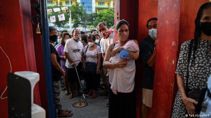 People had queued up at voting booths before polls opened at 6 am local time. 