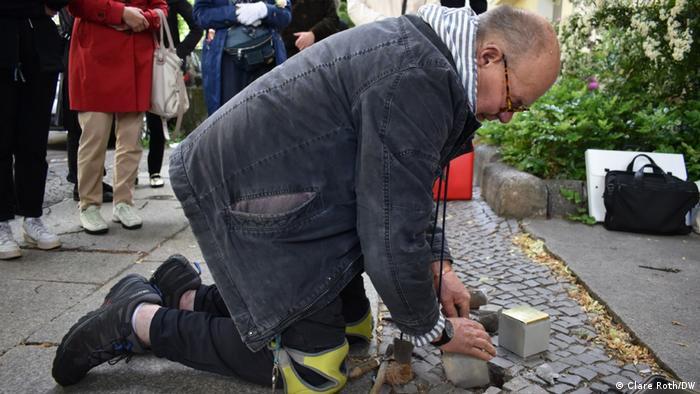 Stone setter Hans-Peter Frank lays a Stolperstein for Sophie Wolff in the Charlottenburg district of Berlin