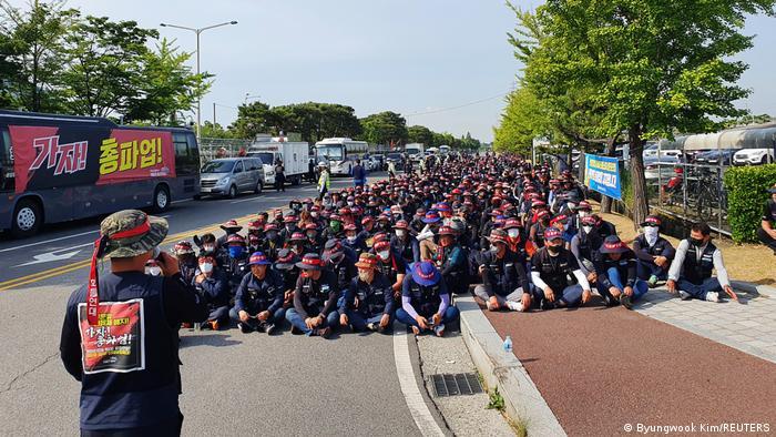 Members of the Cargo Truckers Solidarity union attend a protest in front of Hyundai's factory in Ulsan, South Korea