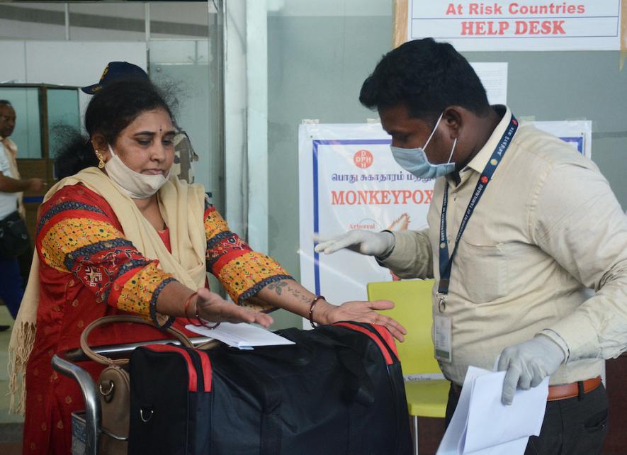 Chennai, June 03 (ANI): Health workers inspect passengers arriving from high risk countries for MonkeyPox symptoms, at Chennai International Airport, on Friday.