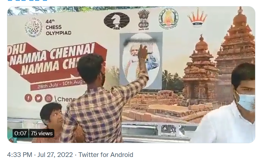 Screenshot of a video of DK cadre spraying paint on Modi’s photo