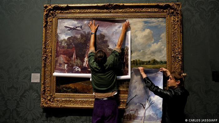 Activists overlay the idyll in "The Hay Wain" with today's harsher environmental reality