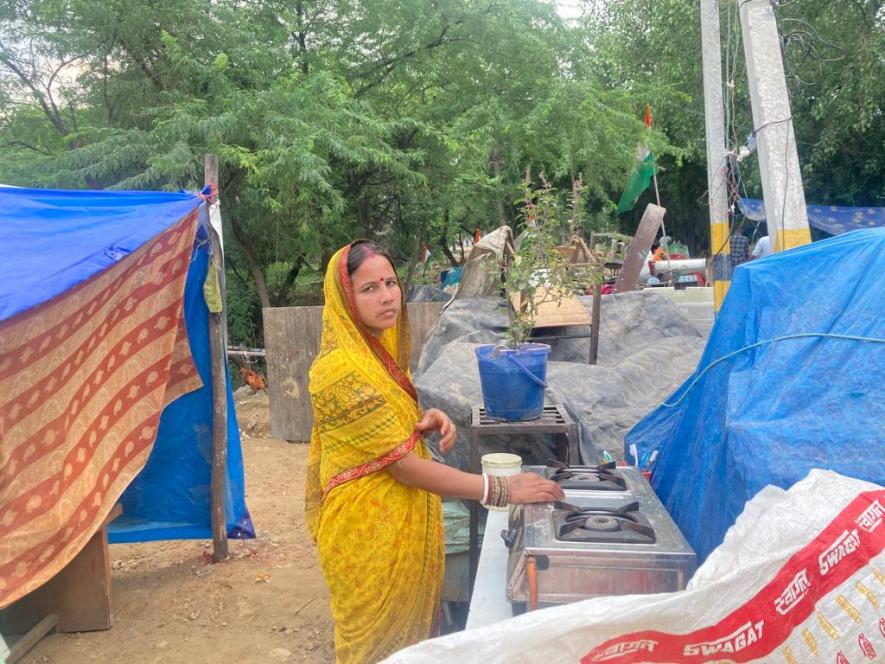 2. Heera Devi, outside the temporary tent shed. Her 2 room house was destroyed on 8th August’s demolition drive