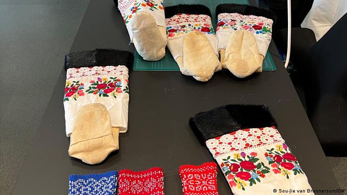 Greenlandic Inuit people traditionally wore kamik made from animal hides, with European fabrics and glass beads added later