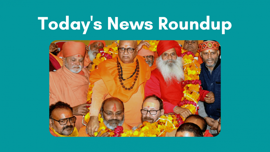 Devotees garland the saints at the ongoing three-day Dharma Sansad, in Haridwar 