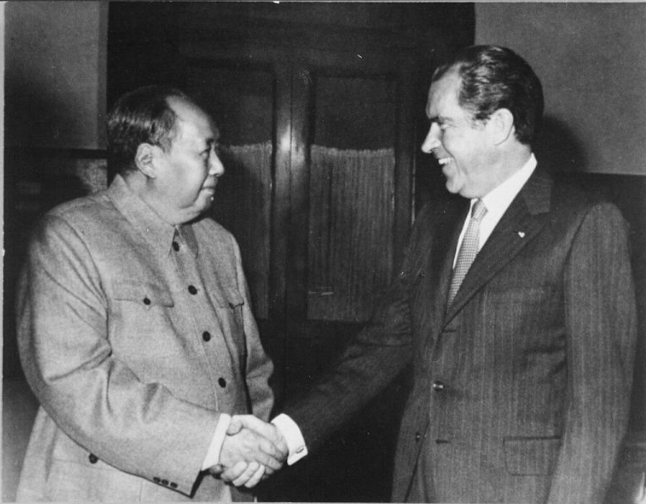 Mao Zedong (L) shakes hands with US President Richard Nixon on weeklong visit to China in Feb 1972 in a historic strategic overture 
