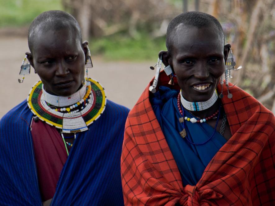 Maasai women in traditional clothing and jewellery in the Serengeti National Park, Tanzania