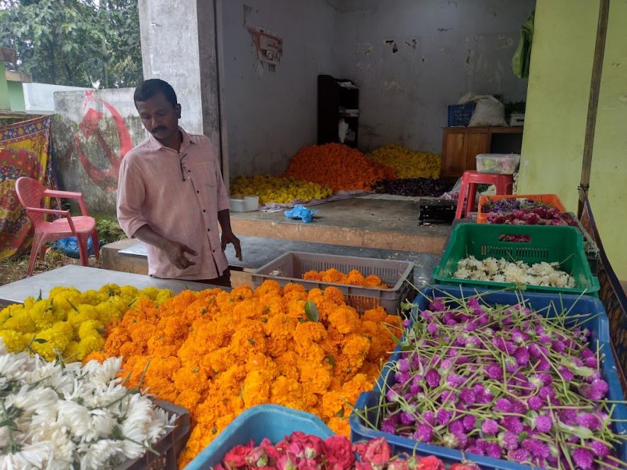 NIshanth selling a variety of flowers for the Onam festival.