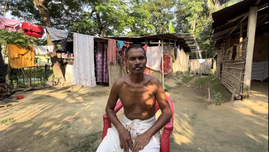 Sonakali Laskar and his dilapidated house in the backdrop in Kampur, Nagaon.