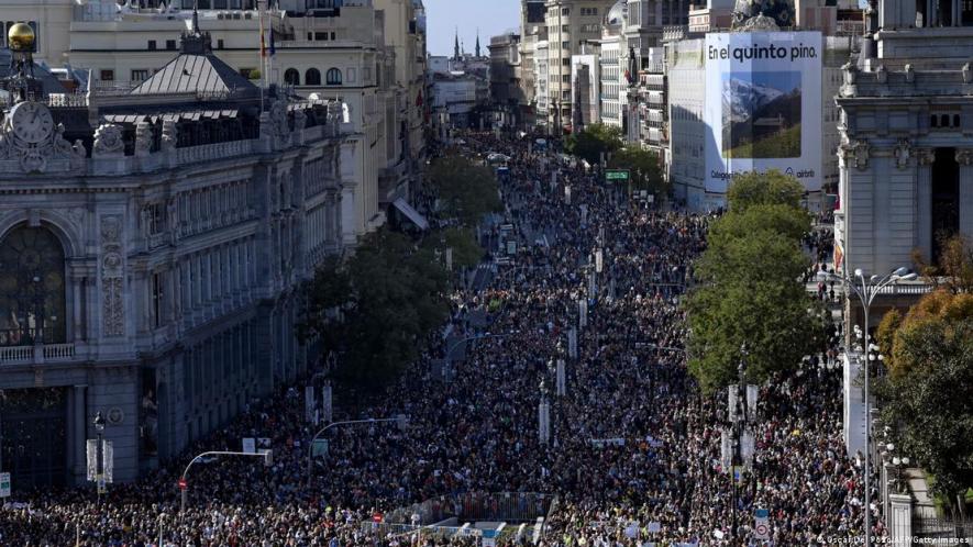 Hundreds of thousands of people marched through central Madrid, including many healthcare workers