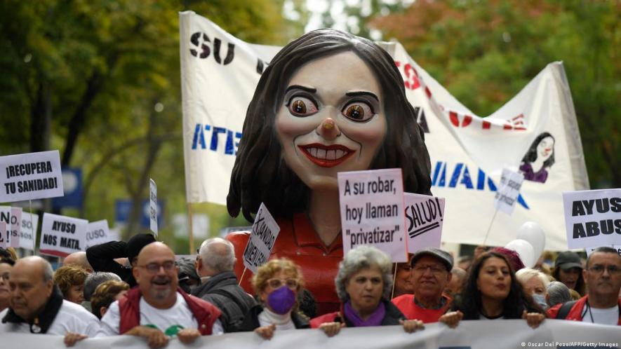 A mocking figure depicts Madrid's right-wing regional head of government Isabel Díaz Ayusu
