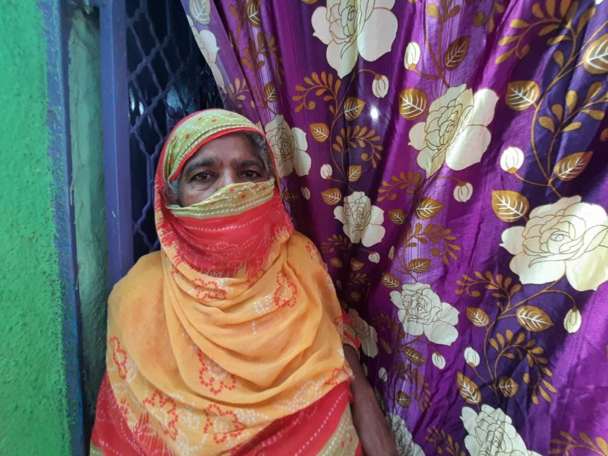 Amina, who lives with her daughter-in-law and grandchildren in the slums of Juhapura. Her house faces severe water-logging every year