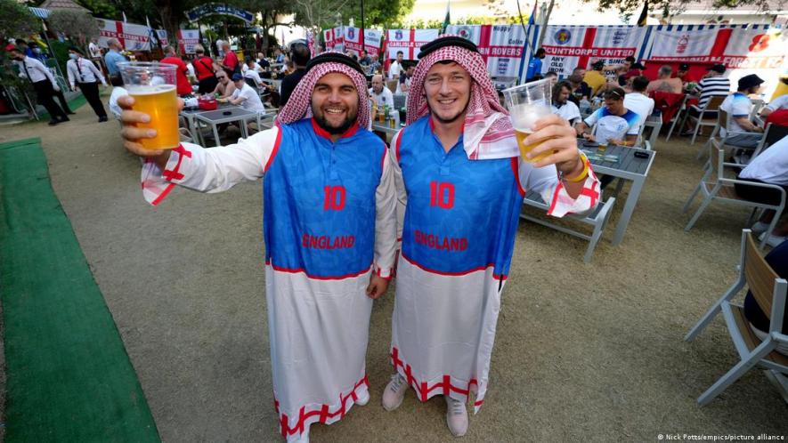 On your head: fans from all over the world, including these England fans, have adopted the ghutra in Qatar