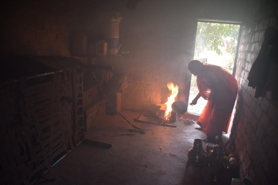Santosh Bai, a resident of Sai Vandana Nagar Slums, in Sanwer Industrial Area of Indore, has been using a mud stove for several years despite having an LPG connection.