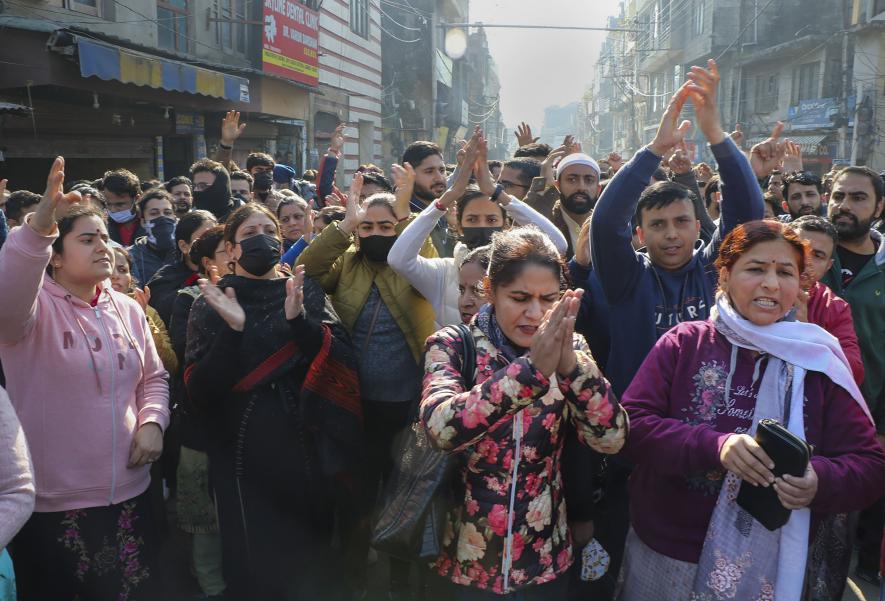 Kashmiri Pandits raise slogans during their protest demanding their relocation after alleged targeted killings of Hindus in J&K, outside Raj Bhawan in Jammu, Monday, Jan. 2, 2023.
