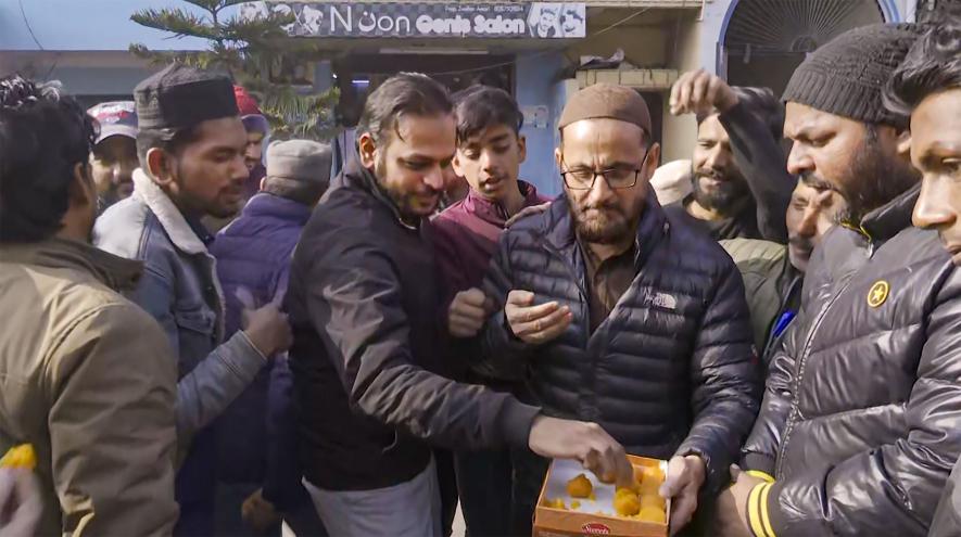 Residents celebrate the Supreme Court's order on Haldwani eviction case, in Haldwani, Thursday, Jan. 5, 2023. The apex court in its order stayed the directions of Uttarakhand High Court on the removal of encroachments from 29 acres of railway land in Banbhoolpura in Haldwani.