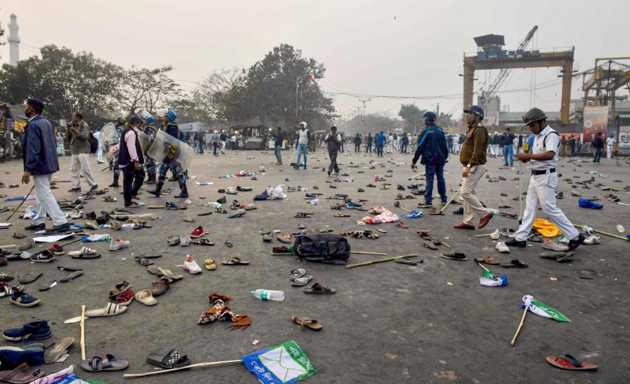 Footwears lie on a road after clashes between ISF members and the police following their rally, in Kolkata, Saturday, Jan. 21, 2023.