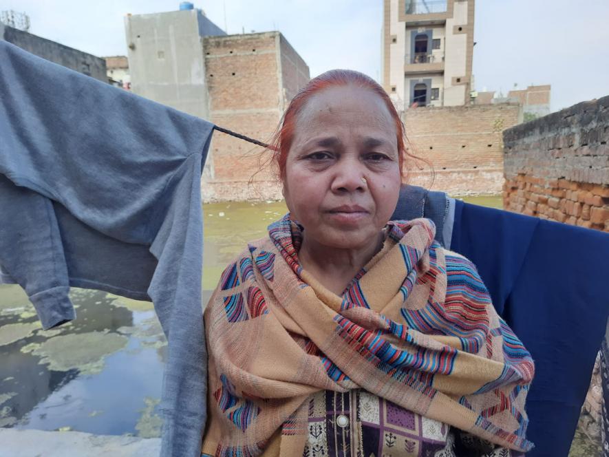 Drishti's mother. She makes envelopes for a living.