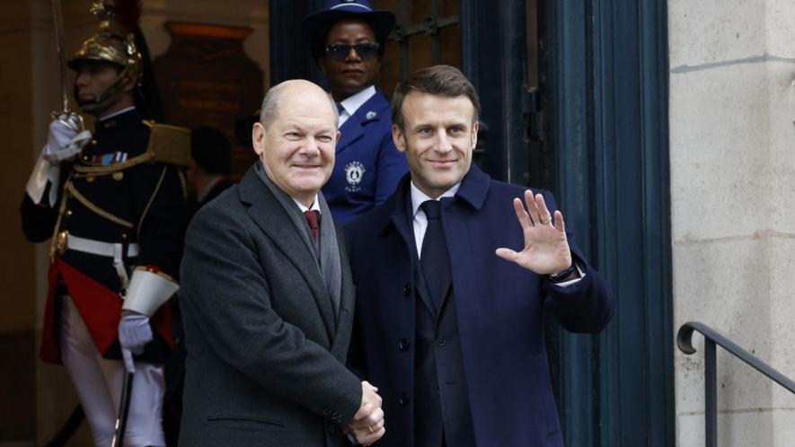 France’s President Emmanuel Macron (R) with German Chancellor Olaf Scholz as they arrive to attend a ceremony marking the 60th anniversary of the Elysee Treaty, Sorbonne university’s Grand Amphitheatre, Paris, Jan. 22, 2023