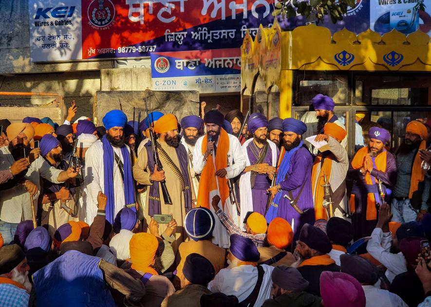 Waris Punjab De' founder Amritpal Singh along with his supporters arrive at the police station demanding release of his associate, at Ajnala near Amritsar, Thursday, Feb. 23, 2023 