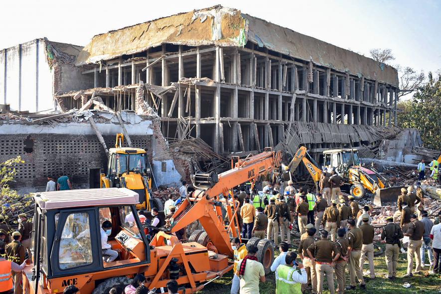 Rescue operation underway after a wall of a building collapsed at Daurala in Meerut, Friday, Feb. 24, 2023. At least 5 people lost their lives in the incident, according to officials.