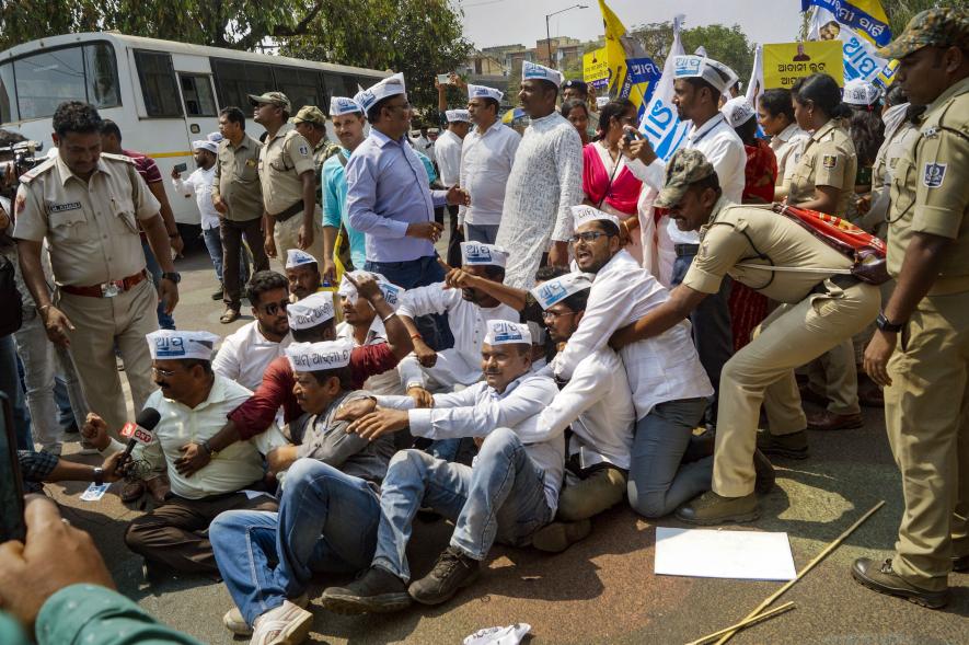 Police personnel detain Aam Aadmi Party (AAP) workers during a protest against the arrest of Delhi Deputy Chief Minister Manish Sisodia by CBI in the excise policy case, in Bhubaneswar, Monday, Feb. 27, 2023.