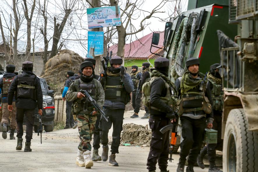 Army personnel at the encounter site where two terrorists are eliminated in an encounter with security forces two days after a Kashmiri Pandit was killed, in Pulwama, Tuesday, Feb. 28, 2023. An Army jawan was also killed. 