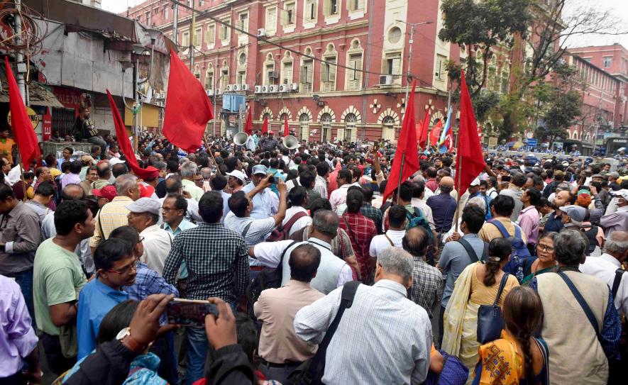 West Bengal government employees during a protest march demanding to clear their pending Dearness Allowance (DA), in Kolkata, Friday, Feb. 17, 2023. Image Courtest: PTI