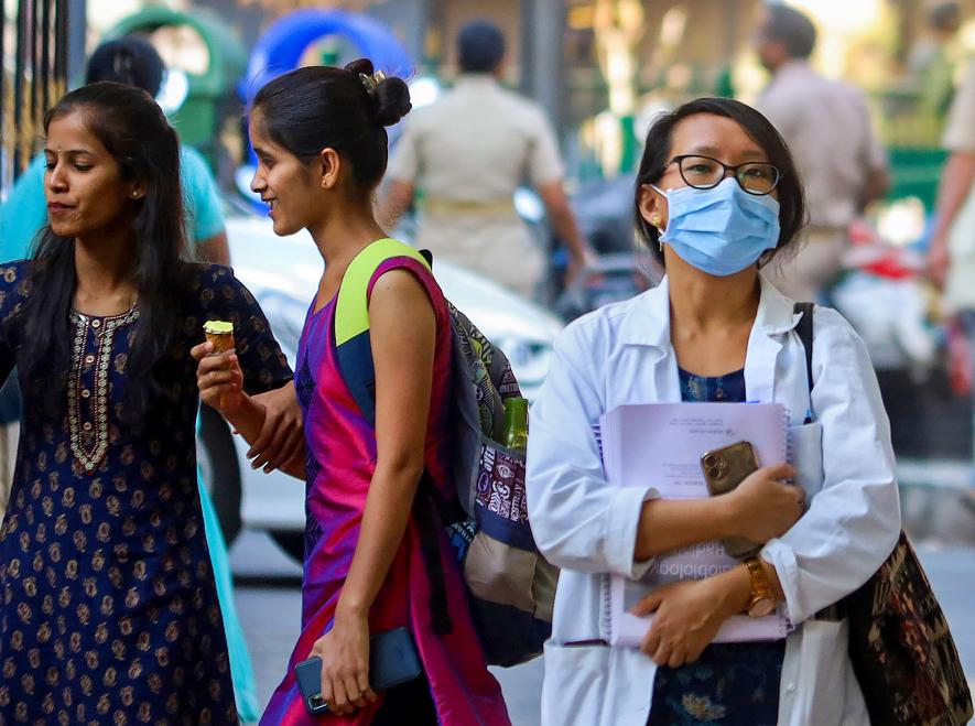 A medical student wears a mask for protection against diseases including H3N2 and Covid virus, at a government hospital, in Bengaluru, Friday, Mar 10, 2023.