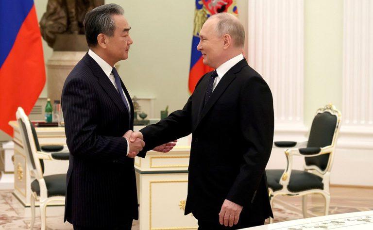 Russian President Vladimir Putin (R) met with Member of the Political Bureau of the Communist Party of China Central Committee Wang Yi, Kremlin, Moscow, February 22, 2023 
