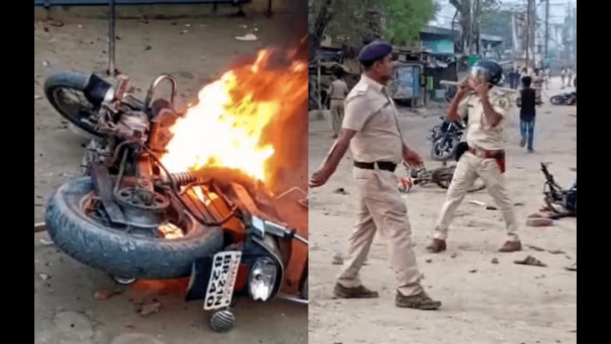 Police personnel maintain law and order after clashes during a Ram Navami procession, in Nalanda district, Bihar.