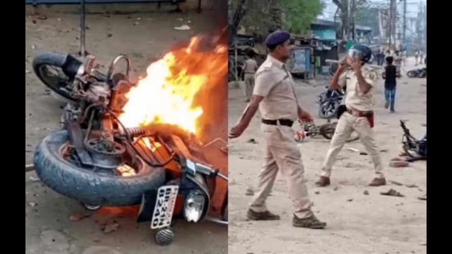 Police personnel maintain law and order after clashes during a Ram Navami procession, in Nalanda district, Bihar. 