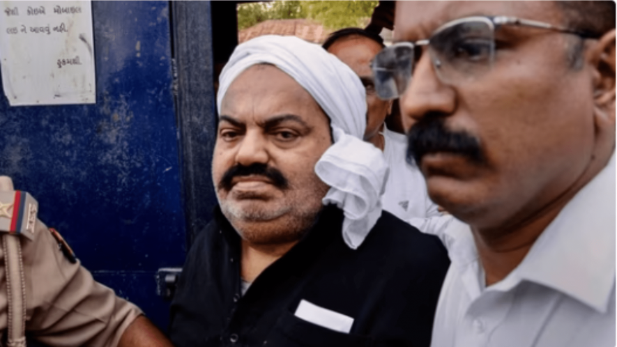 UP Police with jailed-mafia Atiq Ahmed outside Sabarmati Central Jail as he is being shifted to Prayagraj, in Ahmedabad.