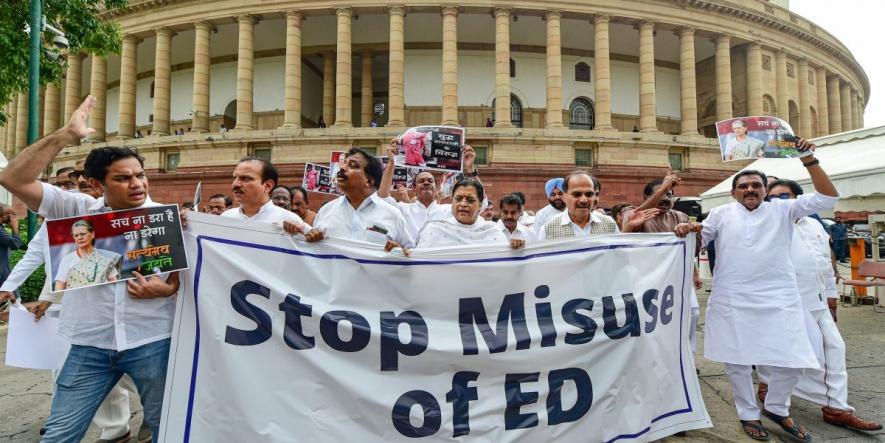 Congress MPs holding banner and placards stage a protest march at Parliament House complex to express their solidarity with the party Chief Sonia Gandhi who has to appear before the Enforcement Directorate in connection with the National Herald case, in New Delhi, July 21, 2022.