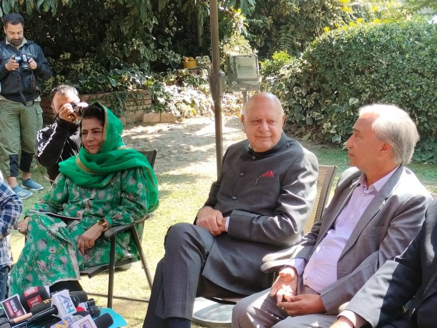 National Conference president Farooq Abdullah (centre) flanked by PDP president Mehbooba Mufti (left) and senior CPI(M) leader MY Tarigami during a press conference in Srinagar on Monday. 